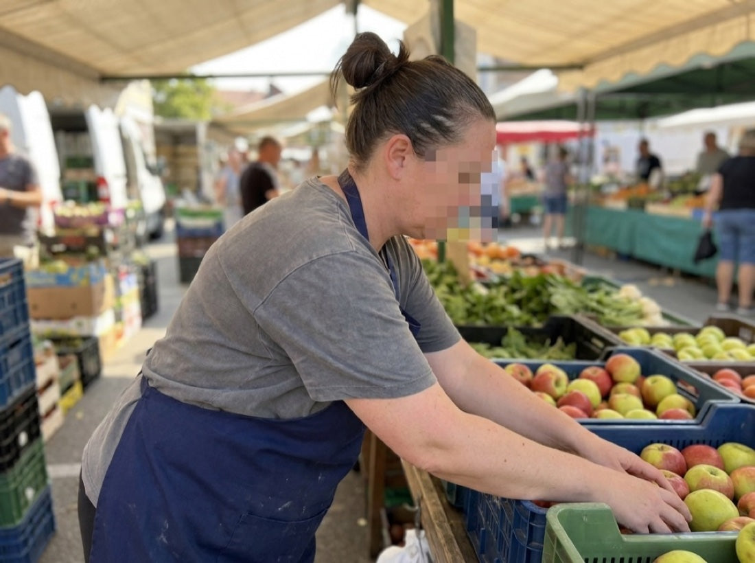 Working alone at the market stall.
